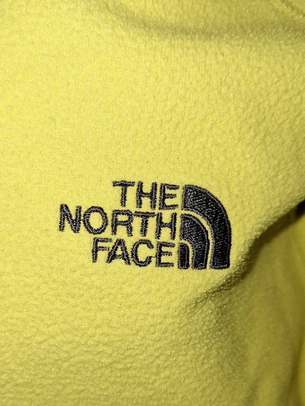 The North Face Bright Yellow Fleece with Black Logo Tag